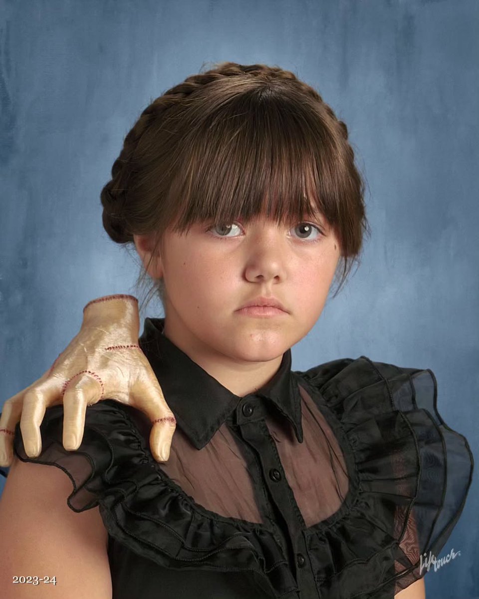 Throwing it back to one of our favorite Picture Day moments for Halloween!  🎃

This student’s resolution? Dress as Wednesday Addams every Wednesday—and she nailed it on Picture Day, complete with Thing! 

We love these creative moments!

<a href="/kaylamariee826/">Kayla</a> 
#Lifetouch #SchoolPhotos