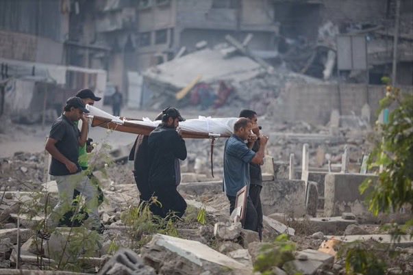 Photos of the funeral procession for the bodies of Palestinians killed by the israelis, mostly children, from the Al-Ahli Baptist Hospital, in Gaza