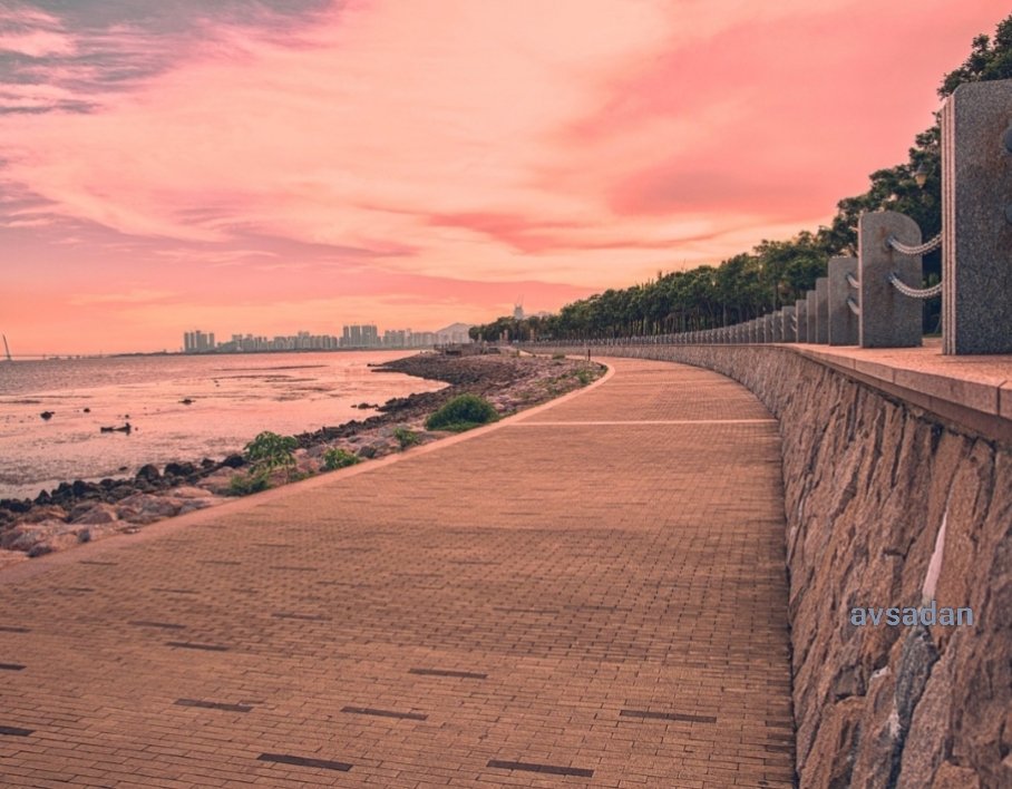A lovely seaside promenade to relish the views of the sunset sky.