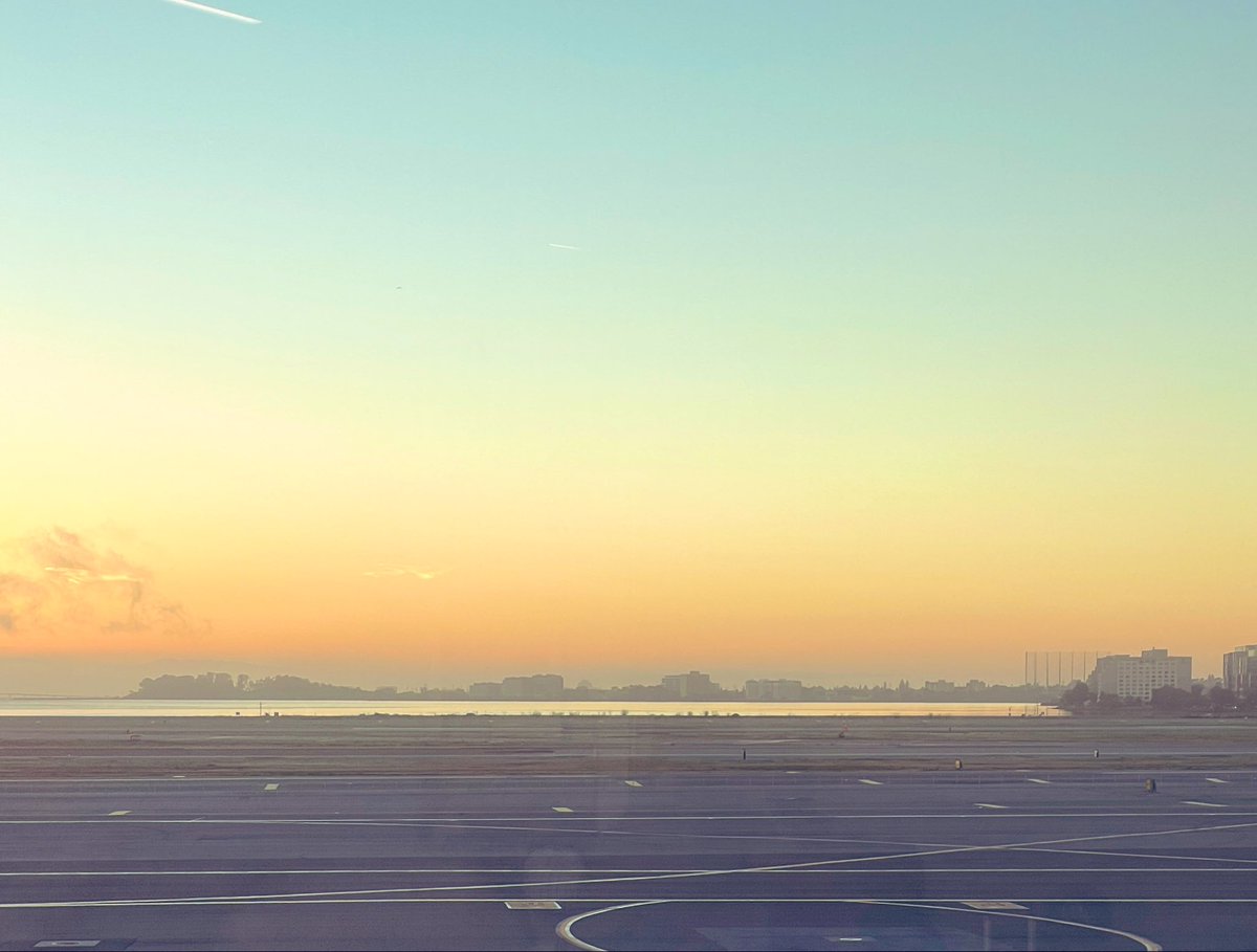 Sunrise over San Francisco Bay, as seen from the runway of SFO International Airport.
