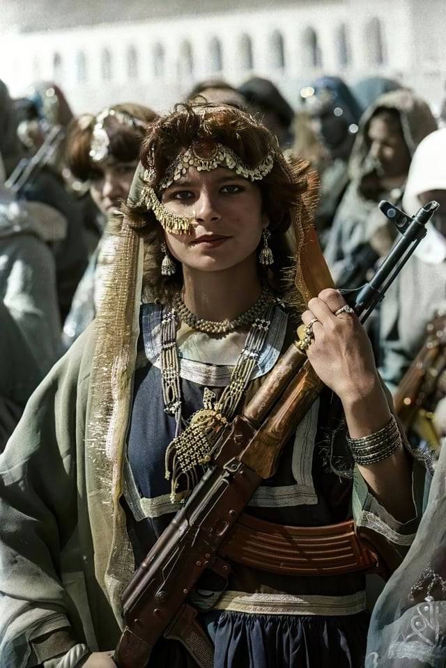 A colorized photo of an Afghan communist revolutionary from the Women's Battalion of the Afghan People's Militia during the Saur Revolution, 1978.