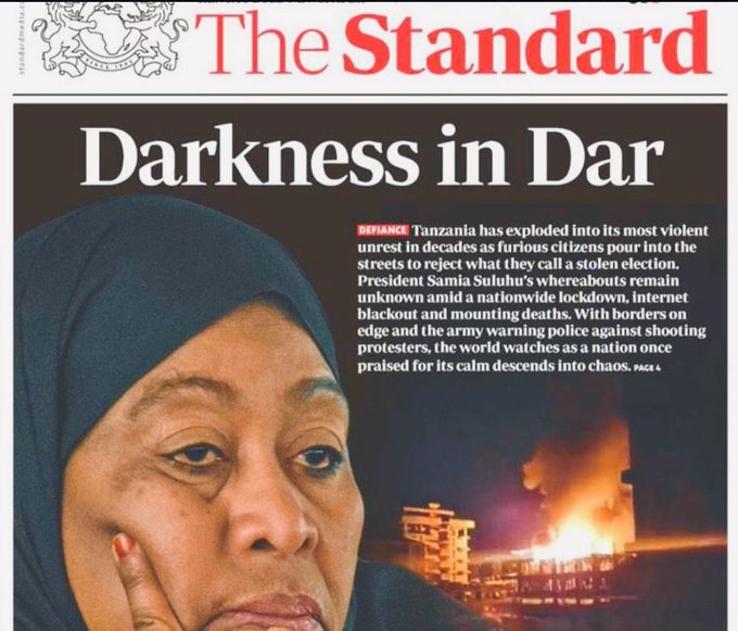 Newspaper front page from The Standard with headline Darkness in Dar about violence in Tanzanian streets during elections, showing image of President Samia Suluhu in hijab looking serious, background of burning streets and protests, article text on opposition protests and internet shutdowns.