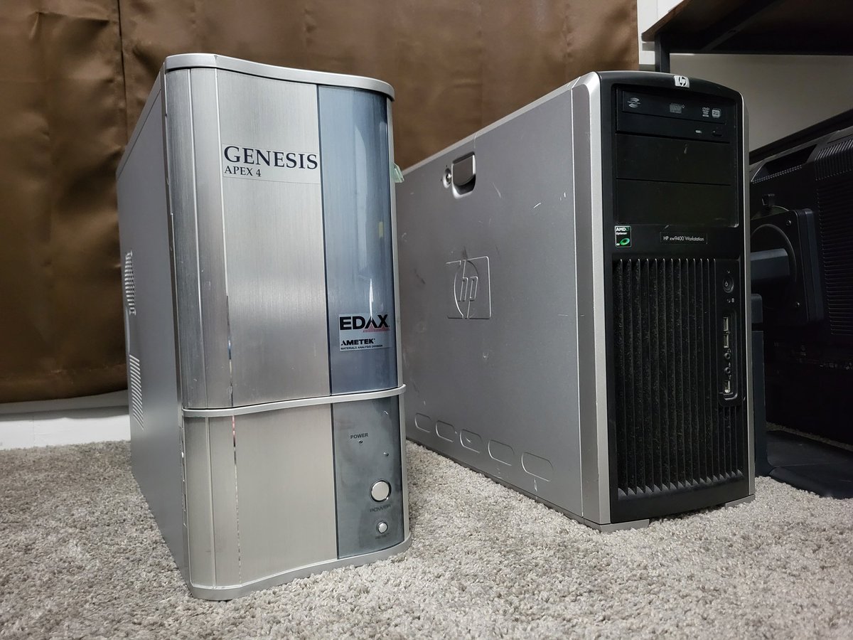 Two new toys from the ewaste bin. Technically they are one, as the Opteron plugs into the back of the other one with a ribbon cable. The silver one just has a power supply and a PCI daughter board thing inside of it with no cpu or anything.