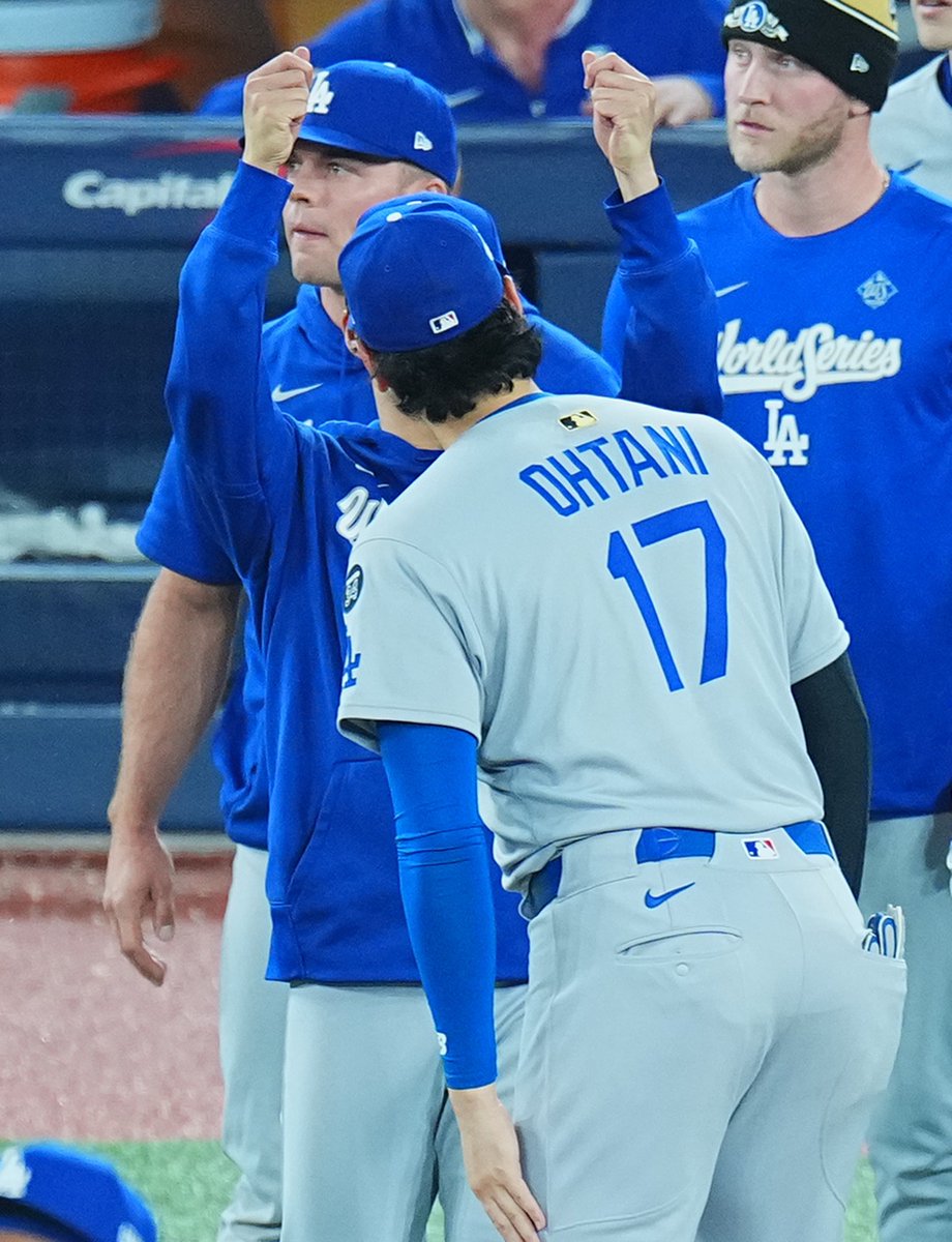 shoheisaveus's tweet photo. So cute Yoshinobu passing the starting pitcher crown 😂 (I dunno what’s that invisible thing) to Shohei 🤣 https://t.co/VAbhP62Qwc