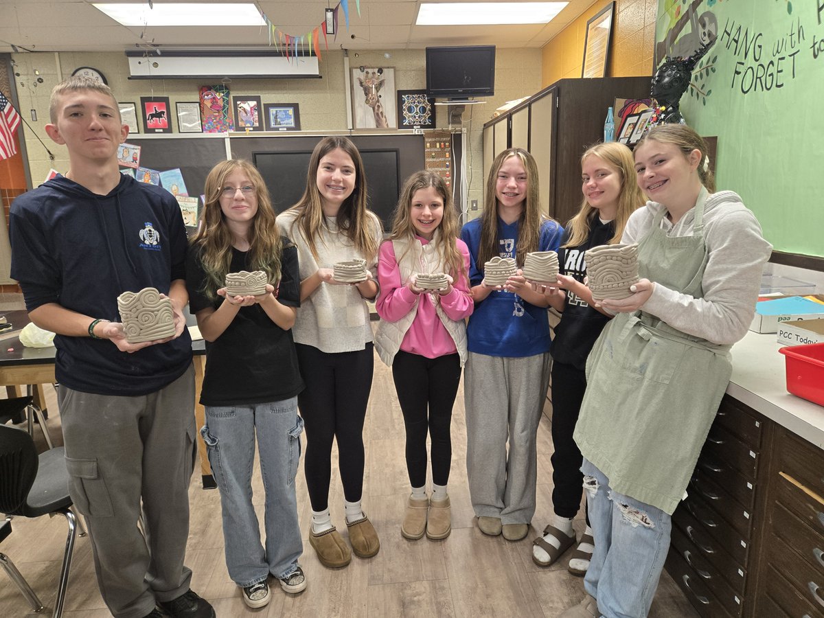 Here are some 8th graders showing off their coil clay pots that they recently created in 8th Grade Art with Mrs. Saathoff. Looks like they did a fabulous job! #WeAreMG