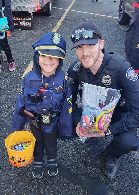 PoliceGap's tweet photo. Officer Eagy and Officer Ramirez enjoying handing out candy at the Sun Comm trunk or treat! #Halloween https://t.co/B58sf89TNV