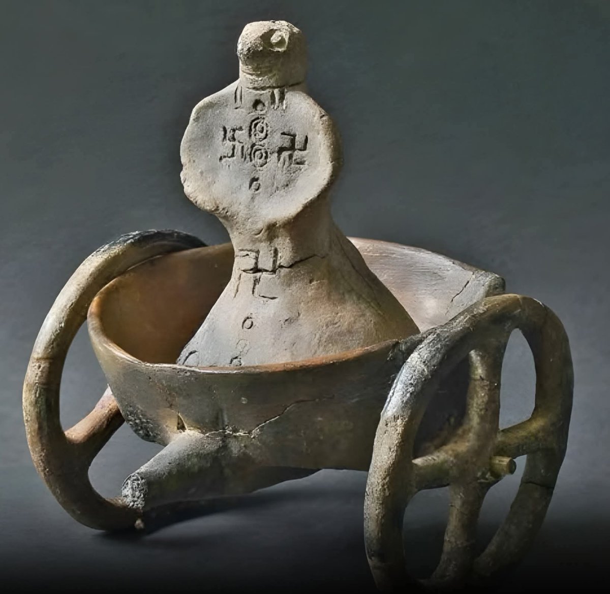 Dr_TheHistories's tweet photo. Archaeologists in Serbia have uncovered a fascinating clay figurine from the Bronze Age Dubovac–Žuto Brdo culture, offering a rare look into the symbolic world of prehistoric Europe. The figure, believed to be over 3,000 years old, depicts a humanoid being seated in what resembles a chariot, an image rarely seen in early art and possibly tied to ideas of movement between the human and divine realms. This unique representation suggests a culture deeply engaged with notions of power, spirituality, and cosmic order.

What truly captures attention is the swastika symbol engraved on the figurine, a design used for thousands of years across civilizations as a sign of the sun, energy, and eternal cycles of life. Long before its modern misuse, the swastika was a sacred emblem of balance and renewal, and its presence here reflects the Dubovac–Žuto Brdo culture’s connection to natural rhythms and celestial forces.

This remarkable find adds a new chapter to our understanding of early European societies along the Danube. It shows how even in the distant past, people expressed profound spiritual ideas through art, turning clay into a vessel of belief, identity, and imagination that still speaks across the ages.

© Institute of Archaeology, Belgrade; Serbian Academy of Sciences and Arts; Archaeology Magazine; Heritage Daily (2025).

#drthehistories