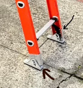 Notice this extension ladder. 

It has a swivel shoe at its base, a pivoting foot that keeps full contact with the ground. This design matters because the physics of ladder stability depend on force vectors and friction.

When you climb, your weight (W) acts along the ladder.