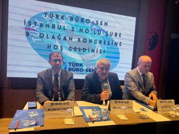 First image shows a man in a suit speaking at a podium with arms raised, wearing glasses, surrounded by red and white flower arrangements and banners reading TÜRKİYE KAMU-SEN and TÜRK BÜRO-SEN, with a blue screen in the background and another person partially visible nearby. Second image depicts a large audience of men and women in formal attire seated in a dimly lit hall with yellow lighting, wooden walls, a Turkish flag, and a banner on the side. Third image features four men in suits seated at a table on stage, one holding a microphone, with nameplates like BAŞKAN and name cards including BASAR VE BÜRO-SEN, against a screen displaying Türk Büro-Sen Istanbul 3 Nolu Sube Olağan Kongresine Hos Geldiniz. Fourth image shows a group of about 20 men in suits standing together in a hall with curved ceilings, yellow lighting, a Turkish flag, and a banner with a circular emblem.