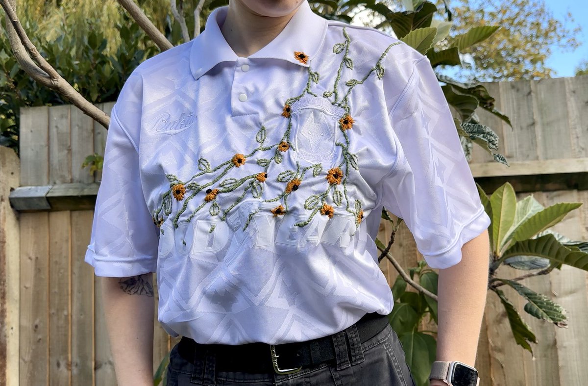 black-eyed susans are supposed to bring optimism, resilience, and justice, so i put some on a wolves shirt to try and break the cycle. unfortunately, i remain skeptical.