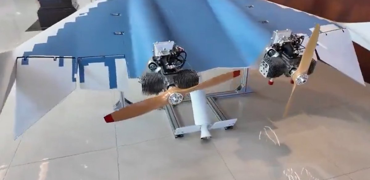 Interesting aero surfaces.

Fins on the RATO is smart design. Inclined RATOs can fly back into the fuselage. Not good with a swinging prop back there. The fins counteract the aero moment on the RATO body as well as increasing the drag. As long as the aircraft is relatively