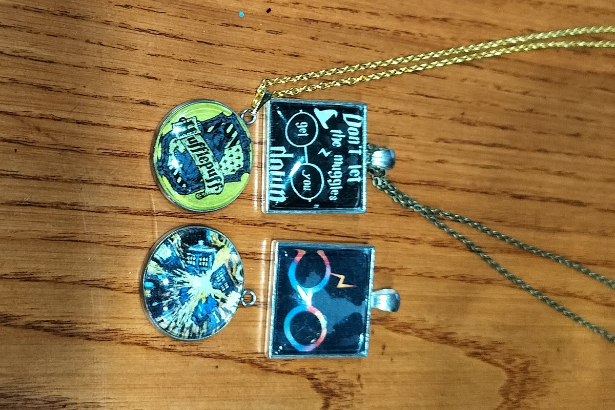 Our members are a crafty lot, and after our jewelry-making meetup this fall, have plenty of HP bling to wear!  Check out the necklaces they made.