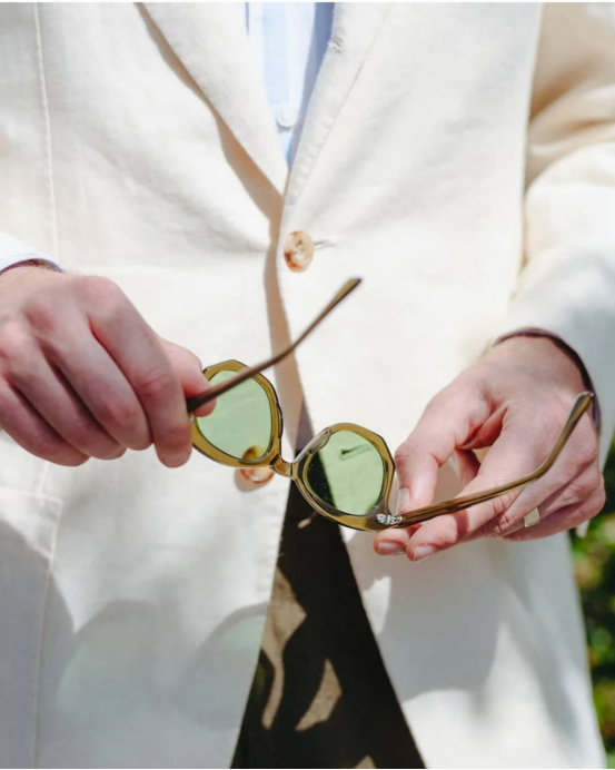 brightway7789's tweet image. “White suit holds, shades await. Fingertips lift, unseen frame forges. Gentleman’s calm, blooms in one grasp. #QuietTech #GentlemanRitual #InvisibleCraft #TimelessPoise”