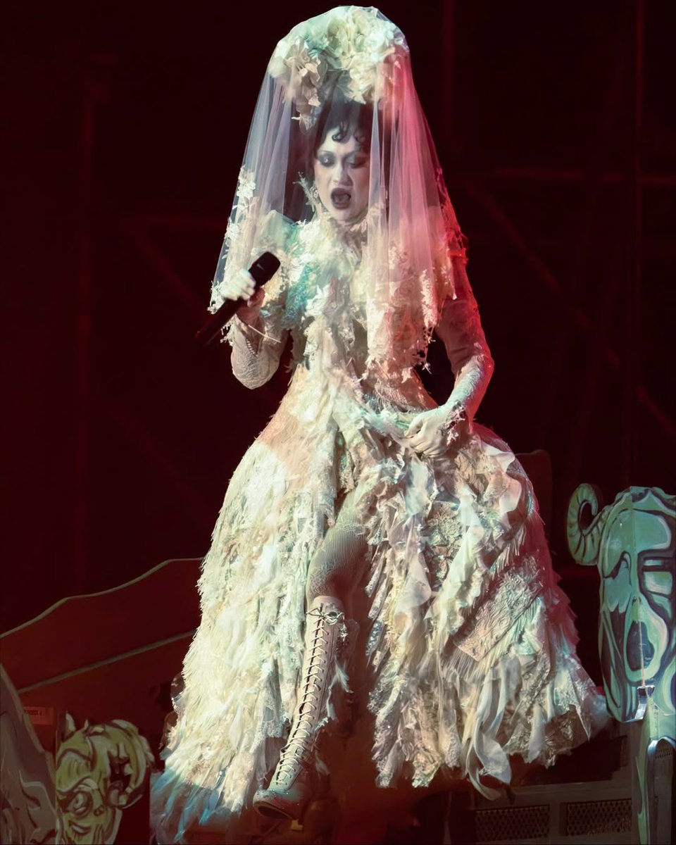 Custom Alexander McQueen inspired by Victorian mourning attire. Tens to everyone involved.