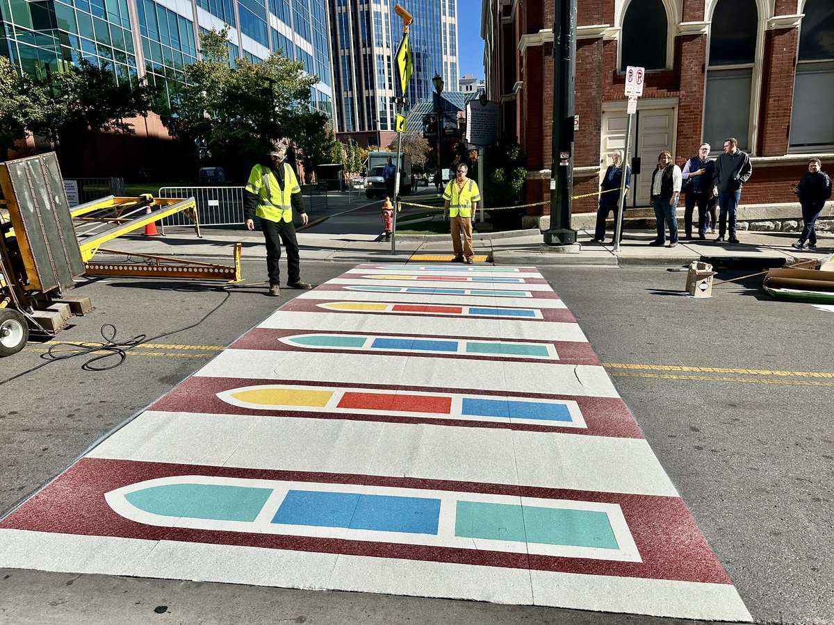 JaxiePidgeon's tweet photo. The streets of Downtown Nashville are a bit brighter this morning! Artists are installing a new, permanent creative crosswalk at Fifth Ave and Broadway that’s inspired by the iconic stained- glass windows of the Ryman Auditorium. 🎨✨

@WKRN | @theryman | @GallagherAsphal https://t.co/zYCszicM7X