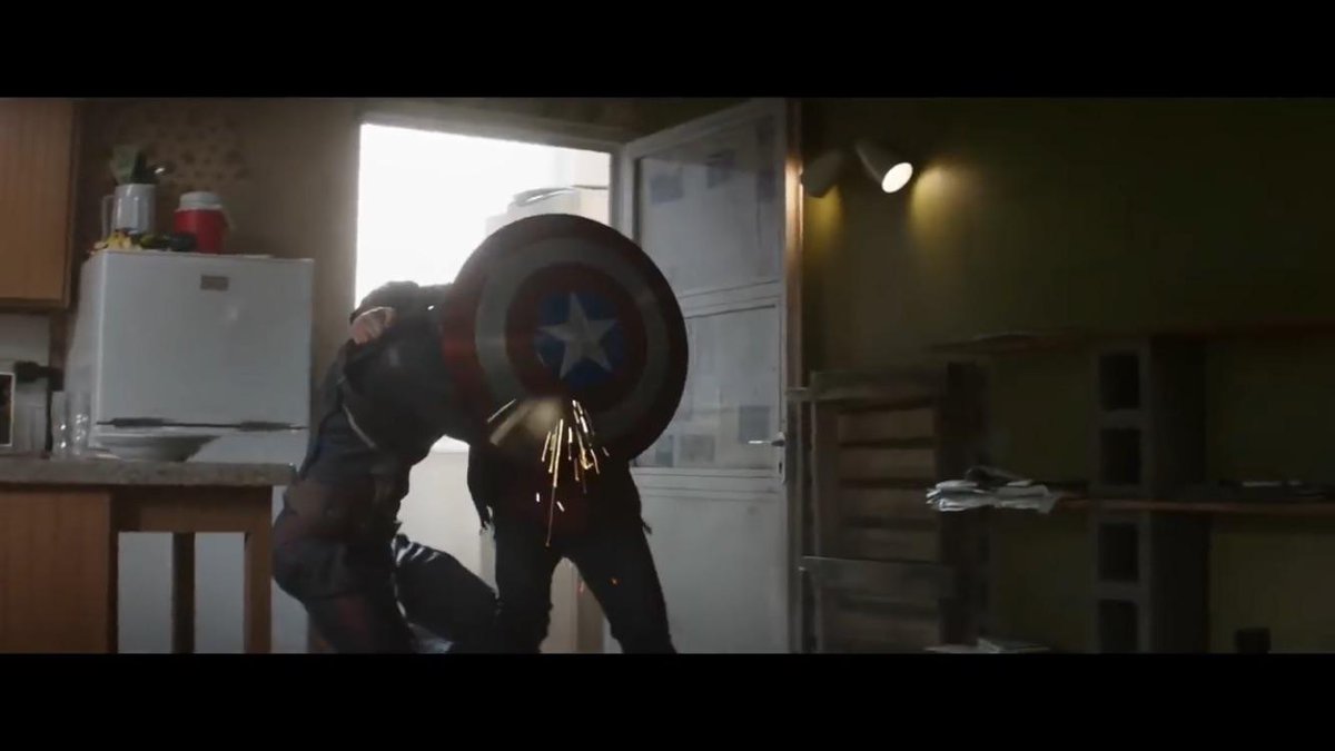umstevebucky's tweet image. another one steve and bucky like this but actually kissing behind the shield