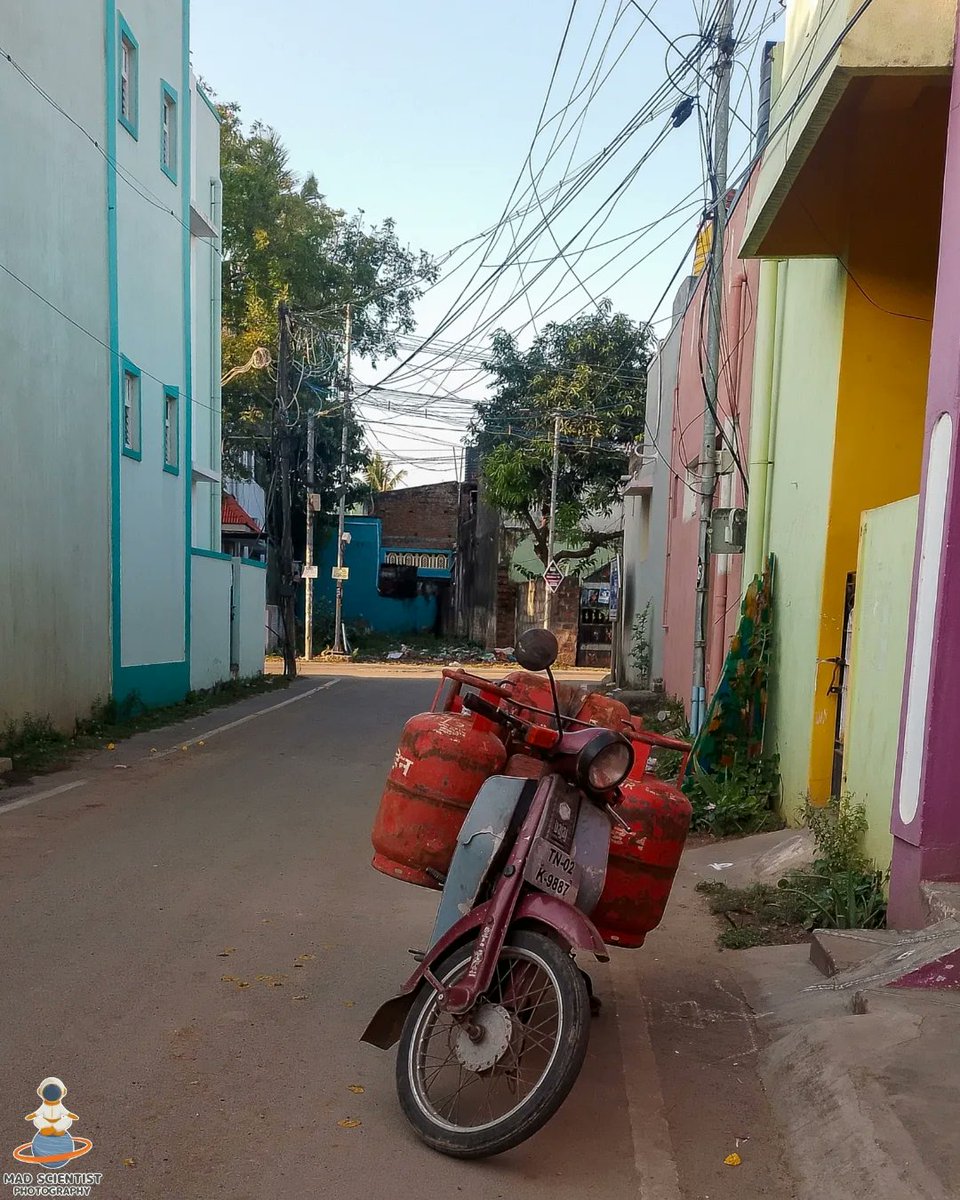 mad00scientist's tweet photo. On the vibrant streets of India, this Bajaj scooter carries more than just gas cylinders—it fuels dreams and livelihoods. Captured in this moment is a perfect example of resilience, innovation, and the unstoppable hustle of everyday life. 🛵 #photography #madscientistphotography https://t.co/1fiK3s6vG6