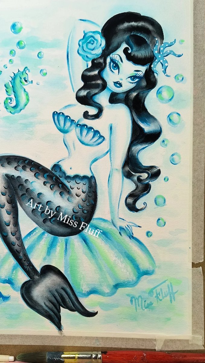 🩵 Happy Mermaid Monday! 🩵⁠
Raven haired mermaid on a shell. Off to her new home!⁠
I painted her with gouache on watercolor paper and added glass glitter at the end. 💋⁠
⁠
#mermaids #mermaidmonday #watercolorpainting