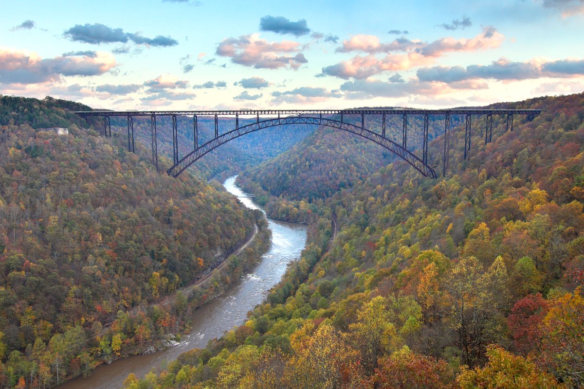 Interior's tweet image. The New River Gorge Bridge is a steel arch marvel stretching 3,030 feet and rising 876 feet above one of North America’s oldest rivers. It’s the third-highest bridge in the United States and one of the most photographed places in beautiful West Virginia.

Photo by @NewRiverNPS