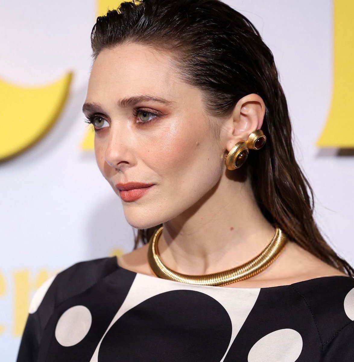 elizabeth olsen’s face card is so lethal