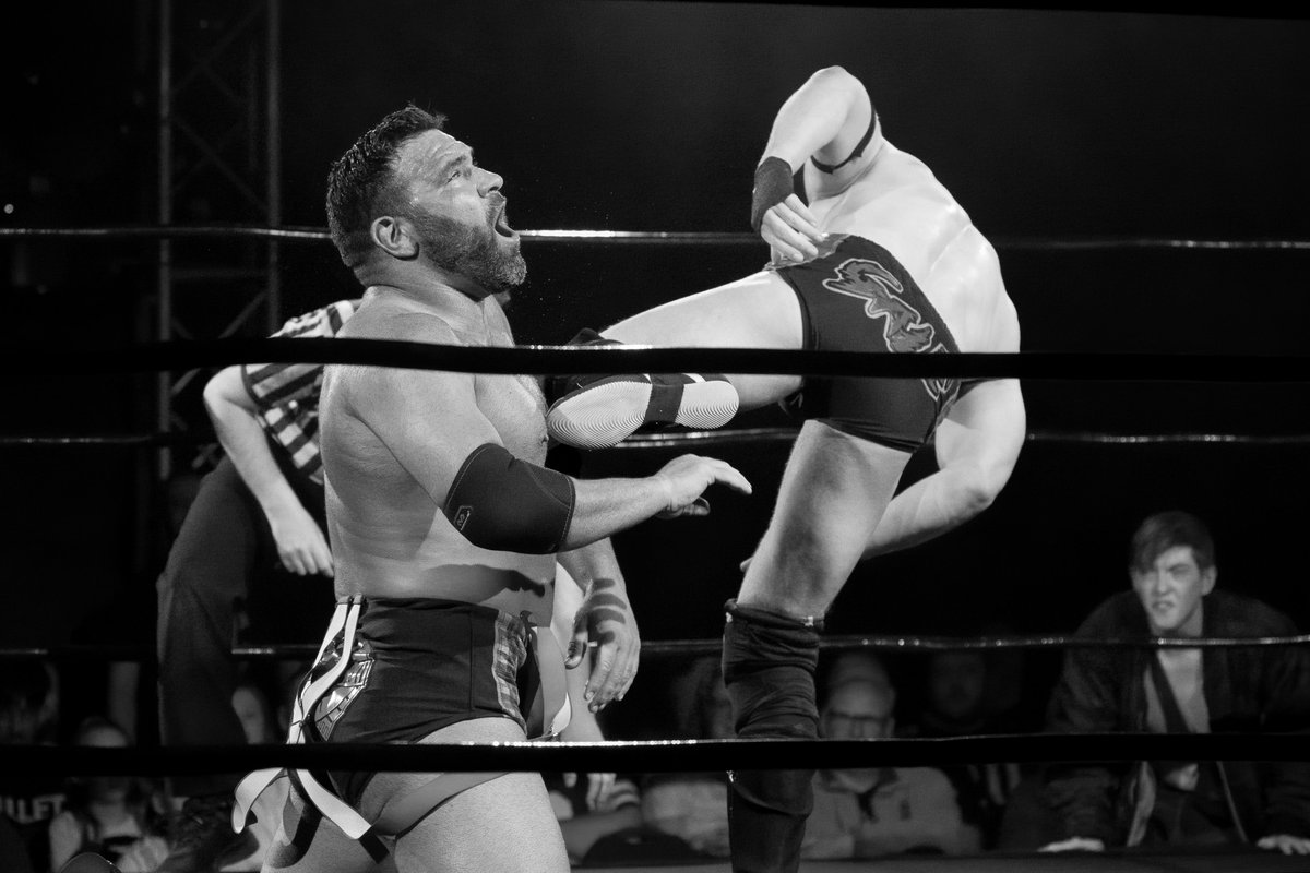 UkWrestlePic's tweet image. Sha getting a hefty kick to the tit from JJ Gale whilst Harry watches and learns, at the Coventry HMV Empire event back in May.
#monochrome #revpro  #wrestling #ukwrestling