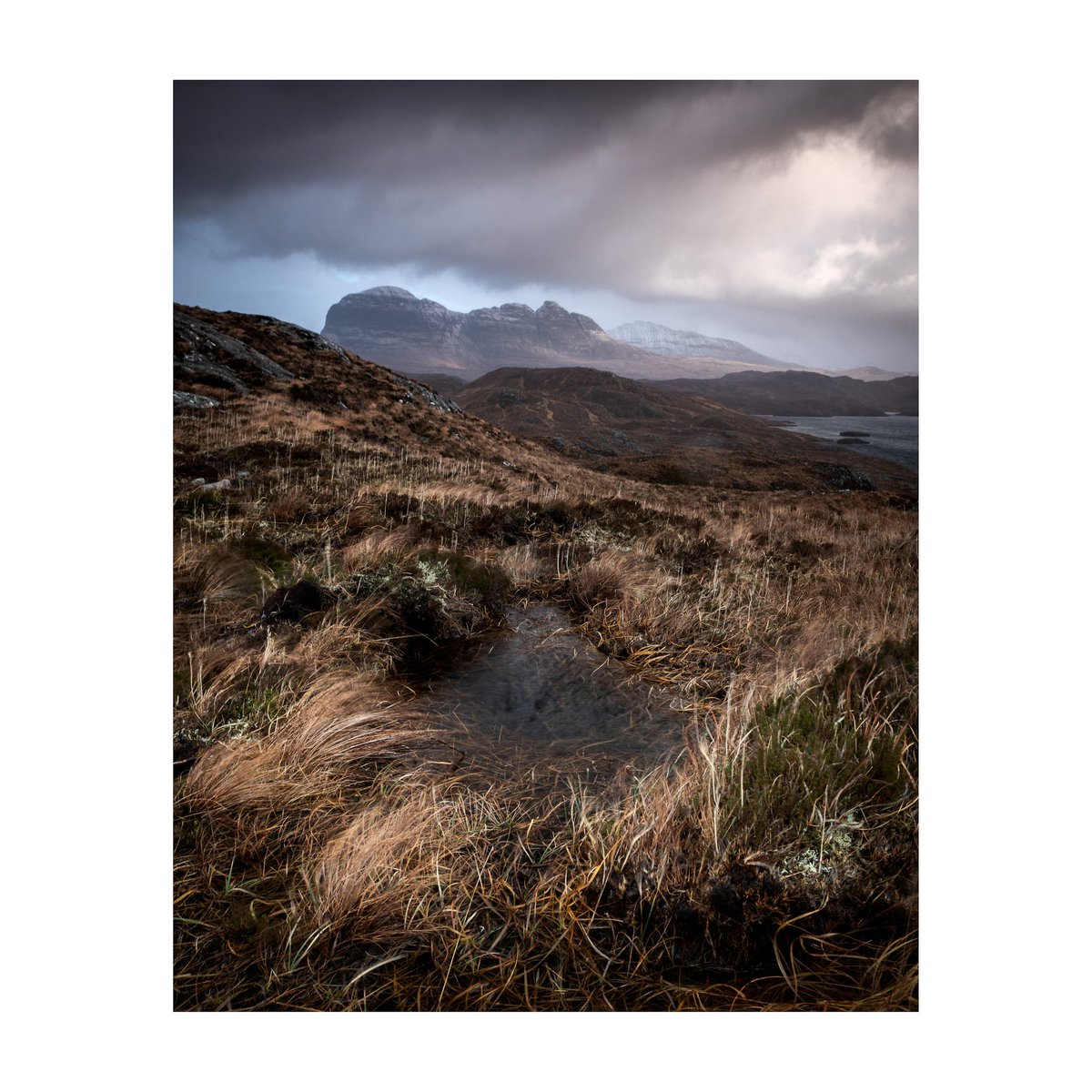 Bleak winter weather brings the odd glimpse of winter light if you can withstand the gloom. 

Assynt, February, 2020.

#Scotland 
#Photography