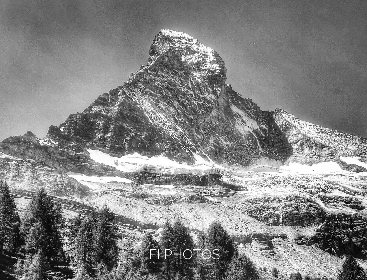 North face ©️ Fi Photos. Snow skirts the base of the Matterhorn and glacier. The mountain is July in the 2026 Calendar.