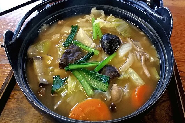 n_hotline_en's tweet image. [Japanese Cuisine] One bowl, a town&apos;s story: 煮ぼうとう. Simmered rustic noodles, seasonal vegetables, and broth steeped in local memory. Want to taste the region in a spoon?