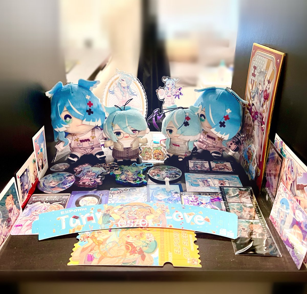 just rearranged all my oshis merch so they all have one shelf each 🩵🧡