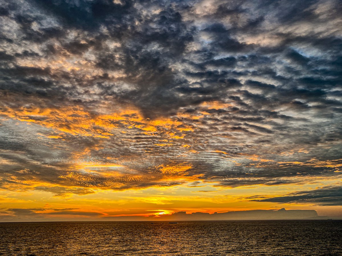 Sunset sinks in shades so wide,
Painting joy across the tide.
With a smile, the day says bye,
Blushing low in crimson sky.