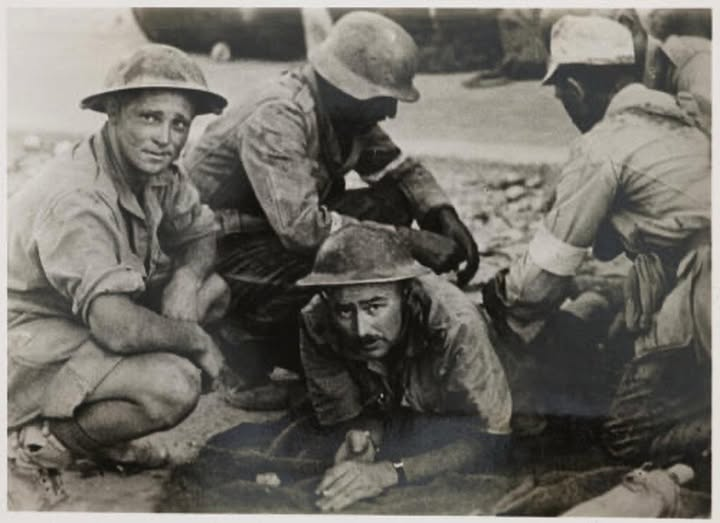 My favourite photo for a long time. German medics attending to a wounded South African in Tobruk, whist his friend looks on, obviously under no threat. Wish I knew what became of these four men. The humanity!
