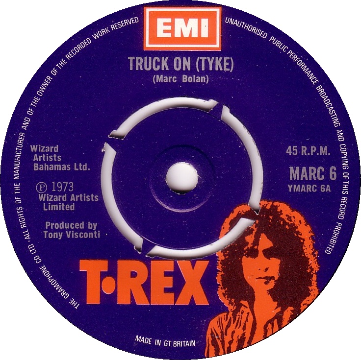 T.Rex’s “Truck On (Tyke)” was released as a 7-inch vinyl single with push-out and solid centre variants in the UK on November 16, 1973, on T.Rex (catalogue: MARC 6). Backed with “Sitting Here,” this glam-rock stomper and mellow B-side (both written by Marc Bolan and produced Tony