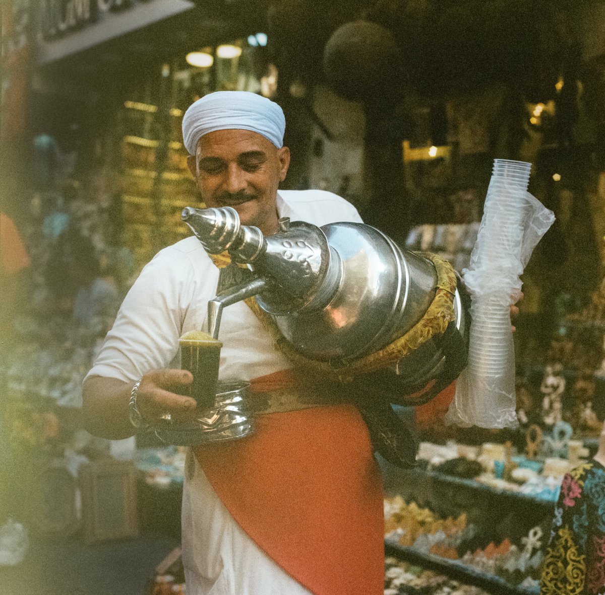 smoothdude's tweet image. A man selling a sweet licorice drink called erk sous in Cairo, Egypt 2025 

photographed on medium format film with a 40 year old Hasselblad film camera