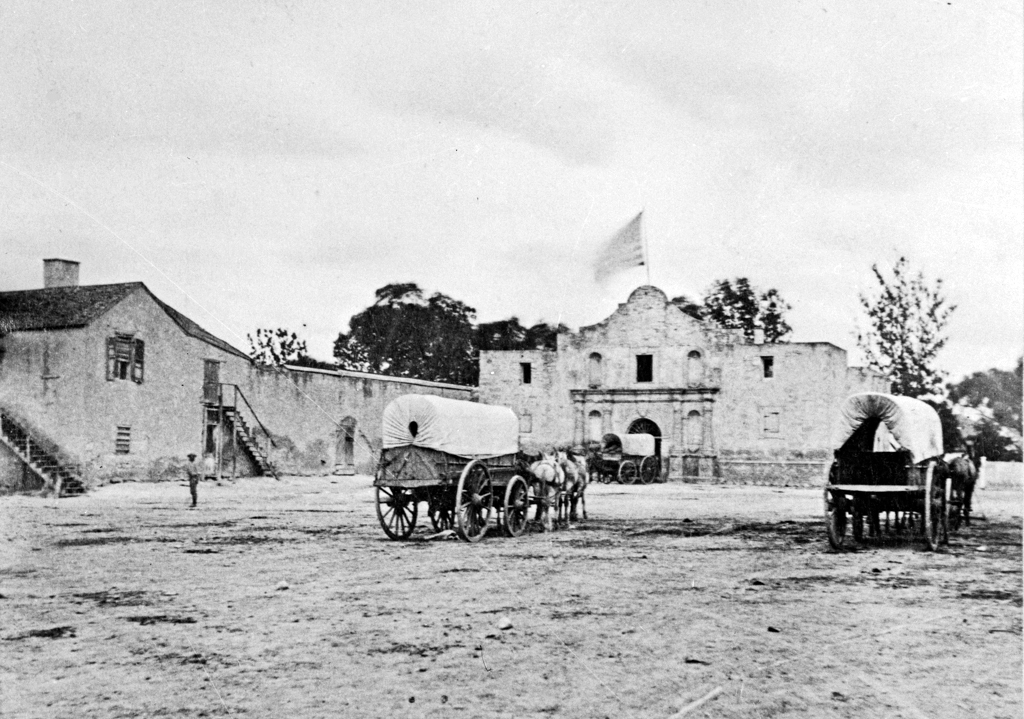 An 1849 photograph of the Alamo, showing the long barracks still standing and a U.S. flag flying above the site. Taken only thirteen years after the battle between General Santa Anna’s Mexican forces and 200 Texian defenders.