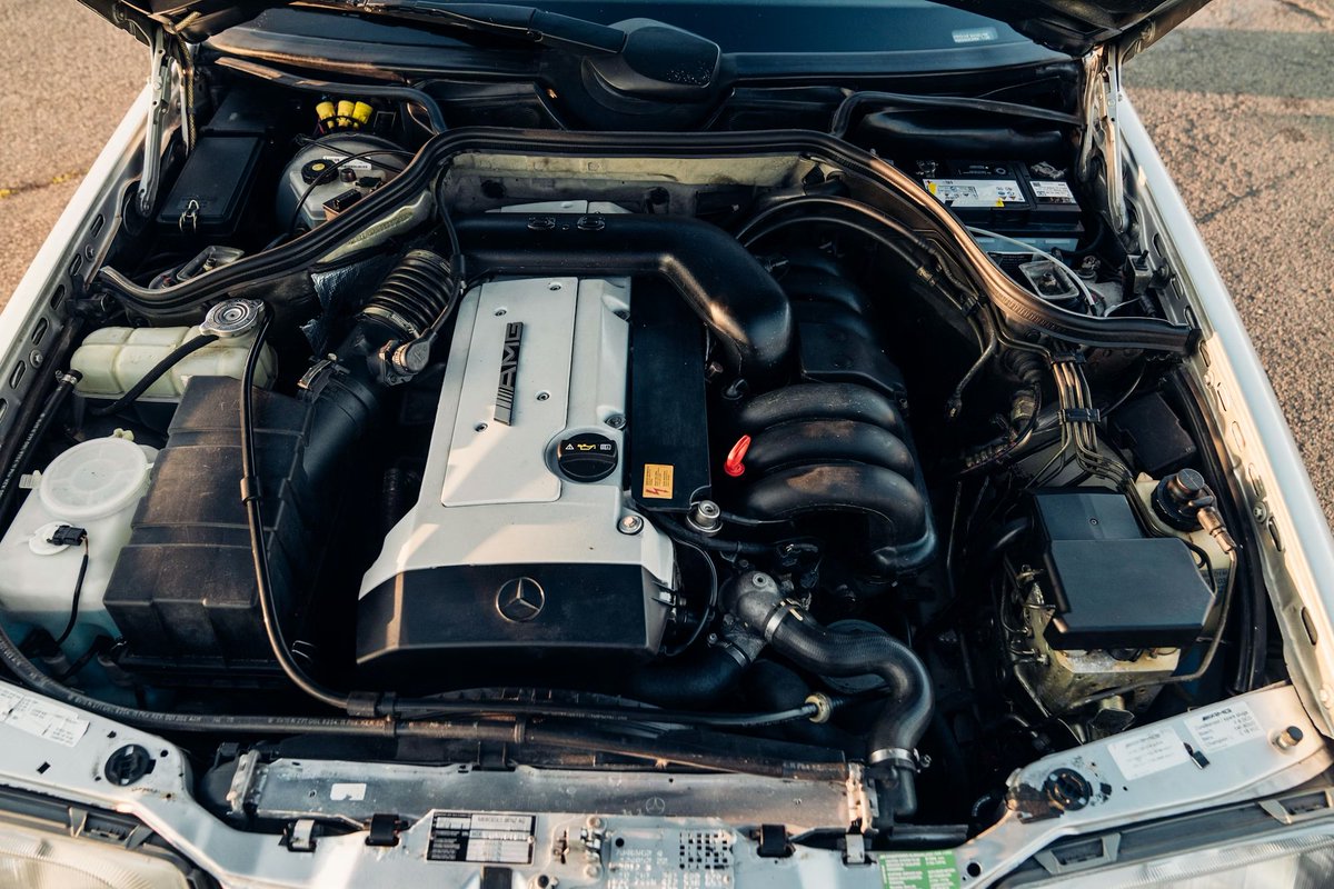 Pre-merger AMG presented with complete visual restraint.
The 3.6-litre M104, hand-assembled to 272 HP, delivered robust mid-range performance in a body that offered almost no visual clues to its capability. Suspension tuning, brake calibration, and drivetrain refinement reflected