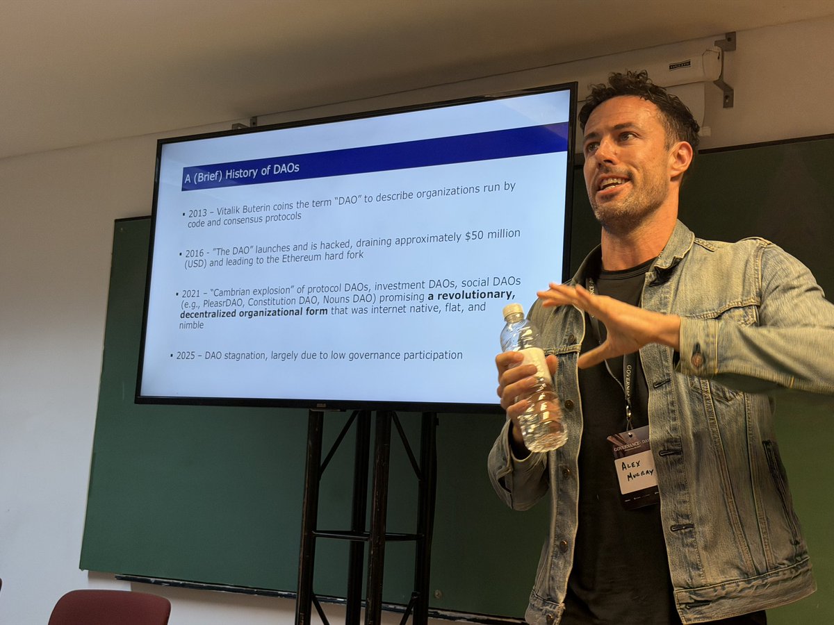 theobtl's tweet image. @alex_m_murray of @uoregon embedding DAOs in a wider context of organization science and entrepreneurship research, before sharing @nounsdao‘s latest findings on AI for governance.