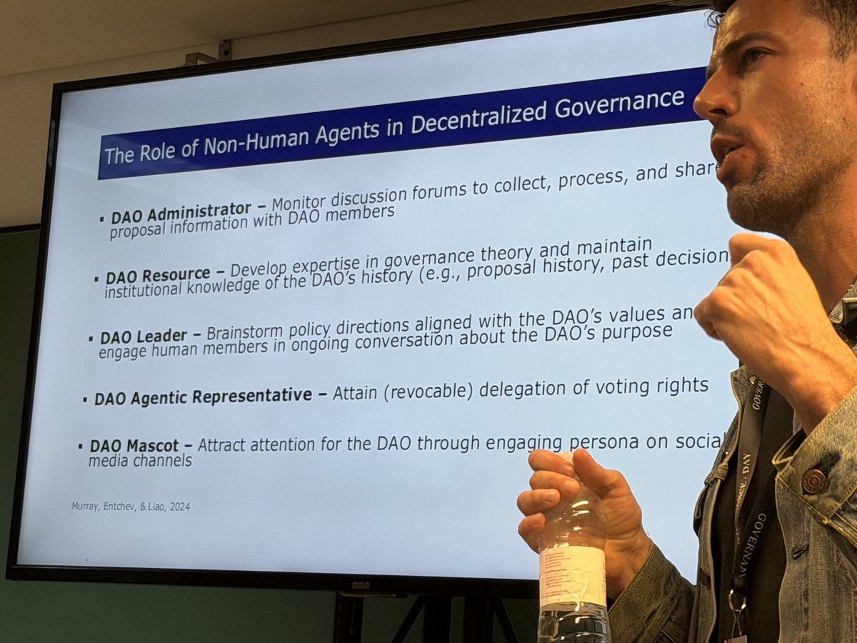 theobtl's tweet image. @alex_m_murray of @uoregon embedding DAOs in a wider context of organization science and entrepreneurship research, before sharing @nounsdao‘s latest findings on AI for governance.