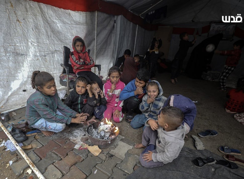 MustafaBarghou1's tweet image. In a worn out tent two elderly Palestinian are trying to take care of their 36 orphan grandchildren. Their five suns, the fathers of the children were all killed by the Israeli genocidal war on Gaza.