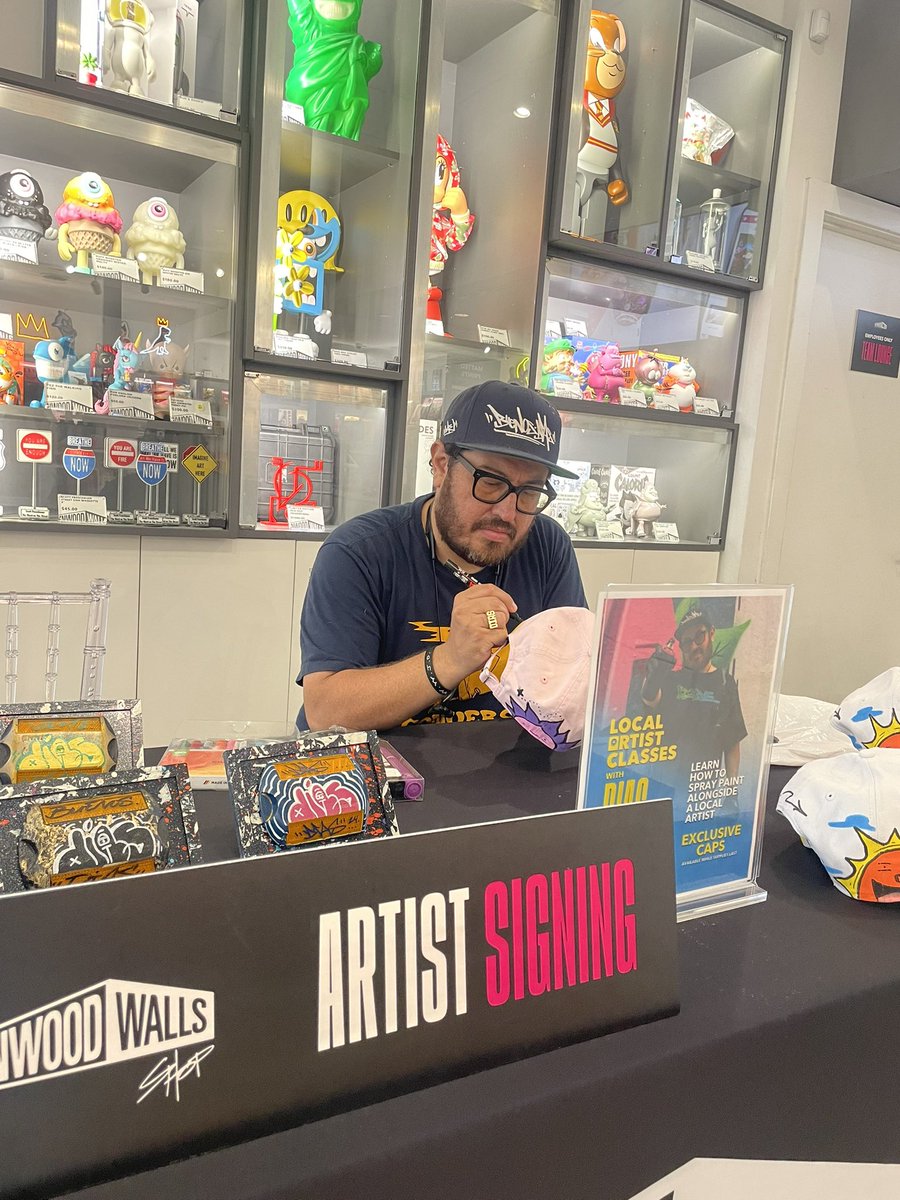 Custom painting hats at Wynwood Walls Miami after my class. Super honored to be here featured as an artist. 🫶🏼