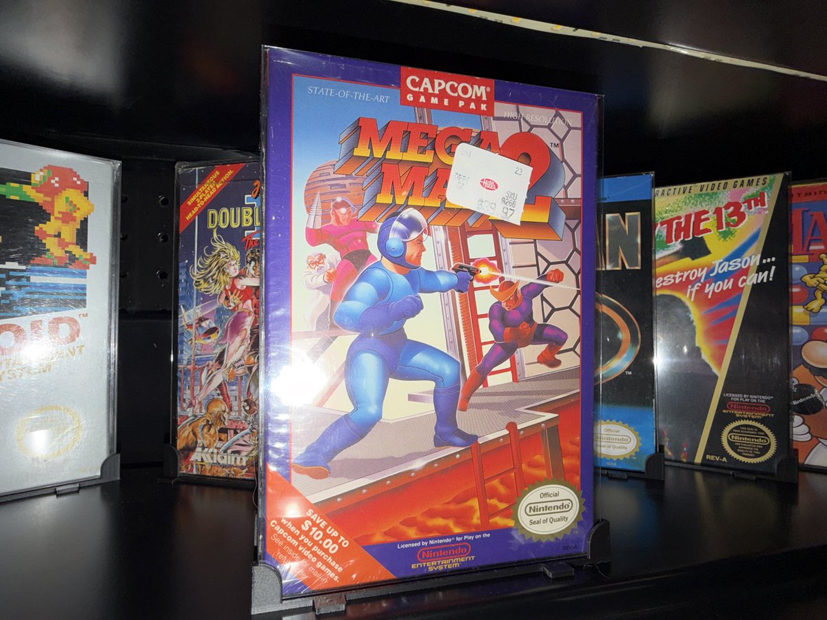 Megaman 2. NES. CIB. Original shrink wrap (opened at the top). Manual has no creases. Cart is mint. Original hang tab. THIS is the quality I was holding out for. $39.99 price tag on the front…. I need a Time Machine.