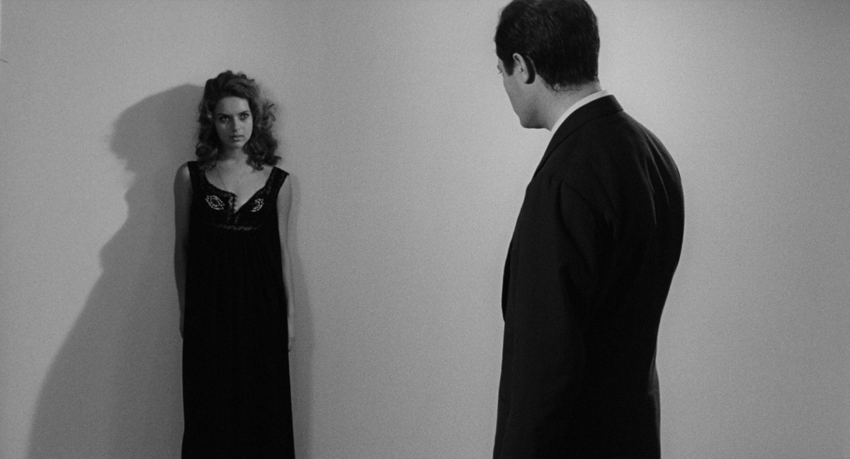 LewisBeerBlog's tweet image. La notte: Marcello Mastroianni inspects a young woman in her hospital room. In this moment, he is a hollow man who casts no shadow; her shadow seems an integral part of her, an extension of the darkness in (and behind) her eyes, and a commentary on the surrounding white void.