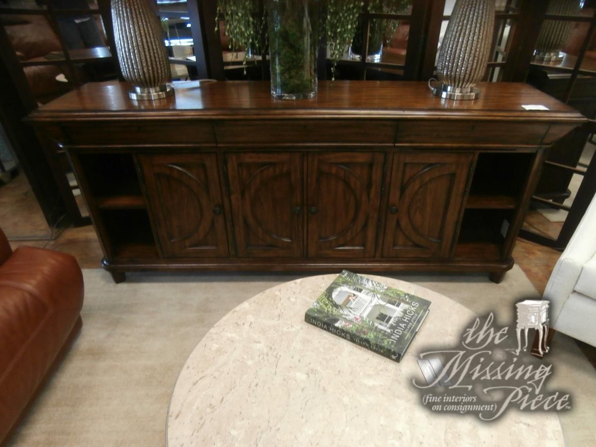 Stanley media cabinet with four doors and smaller shelving on each side for display. Measures 84"W,20"D,36"H in brown. 
Click here for pricing and availability ➡ buff.ly/HkqMIiT