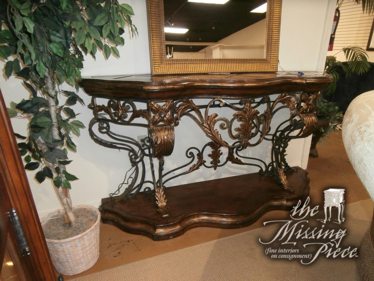 Marge Carson console table done in an Old World briar finish with aged gold leaf finish trim and decorative metalwork. Measures 74"W,22"D,39"H.  
Click here for pricing and availability ➡ buff.ly/sspTa7e