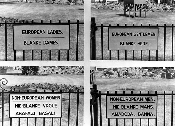 Signs both English and Afrikaans in Johannesburg, South Africa, 1957. Image Source: ullstein bild