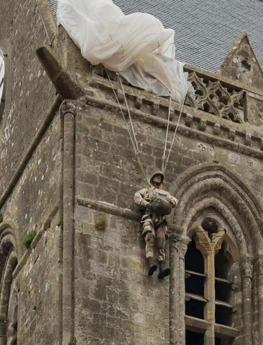archeohistories's tweet image. On D-Day, June 6, 1944, paratrooper John Steele’s parachute snagged on a church steeple in Normandy. He hung there for two hours, pretending to be dead as the battle raged below. Today, a mannequin still hangs from the steeple in his honor.

Steele became part of one of the most…