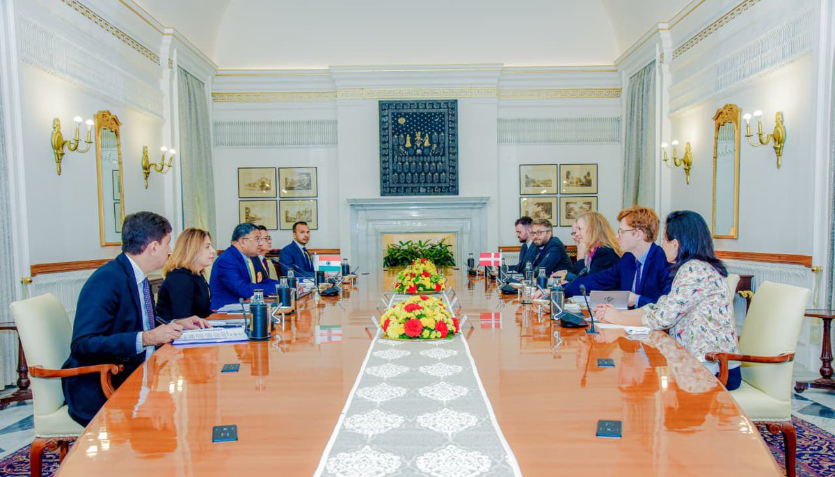 MEAIndia's tweet photo. 8th India-Denmark Foreign Office Consultations held in New Delhi today. Co-chaired by Secretary (West) @AmbSibiGeorge & State Secretary for Foreign Policy Ms. Lotte Machon.
 
They took stock of the ongoing bilateral cooperation under the India-Denmark Green Strategic Partnership and the Joint Action Plan for the term 2021-26. Both sides reaffirmed the commitment to widen the scope of collaboration further in the areas of political engagement, trade & investment, renewable energy, sustainability, clean technologies, circular economy, shipping, water, agriculture & animal husbandry, food processing, research & development and mobility. They also agreed to further cooperation in the areas of defence & security, new & emerging technologies and the Arctic. Both sides reiterated their commitment towards fighting terrorism in all its manifestations.   
 
Denmark is a trusted partner in the EU. The Danish side reiterated its support for early conclusion of India-EU- FTA during 🇩🇰’s ongoing Presidency of the Council of the European Union. Both sides exchanged views on regional and global issues of mutual interest and agreed to strengthen multilateral cooperation.