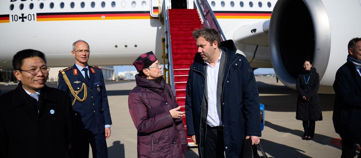 Germany's vice chancellor arrives in Beijing and truly looks like a passenger on a long-haul flight