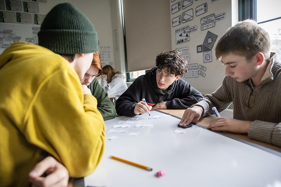 nfaschool's tweet photo. Students in Mr. Nelson’s Honors Algebra II class work on a series of mathematical puzzles during a recent class session. https://t.co/aGgIRrdY5Y