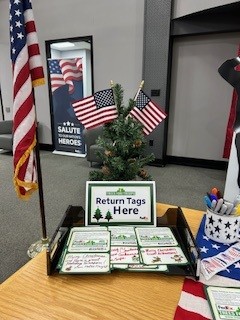 Trees4Troops's tweet image. At the Harrison, AR FedEx facility, employees and families handwrite tree tags for donated Christmas trees. One family completed 75 tags in one afternoon. Small notes, big impact. 💜🎁

What message would you write to a military family?

#TreesForTroops #FedExCares