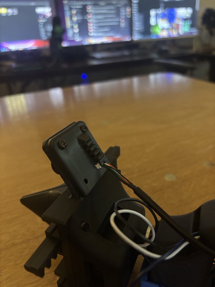 Co_M_Ma's tweet photo. Here’s a picture of my first “living hinge” that I added to our robot. The lil squiggly thing (a 2D spring) holds the wire in place but is complaint enough that if pulled really hard, it will release the wire preventing it from breaking. 
Check out @NickBuilds11 for the full bot! https://t.co/j1omoobgb7